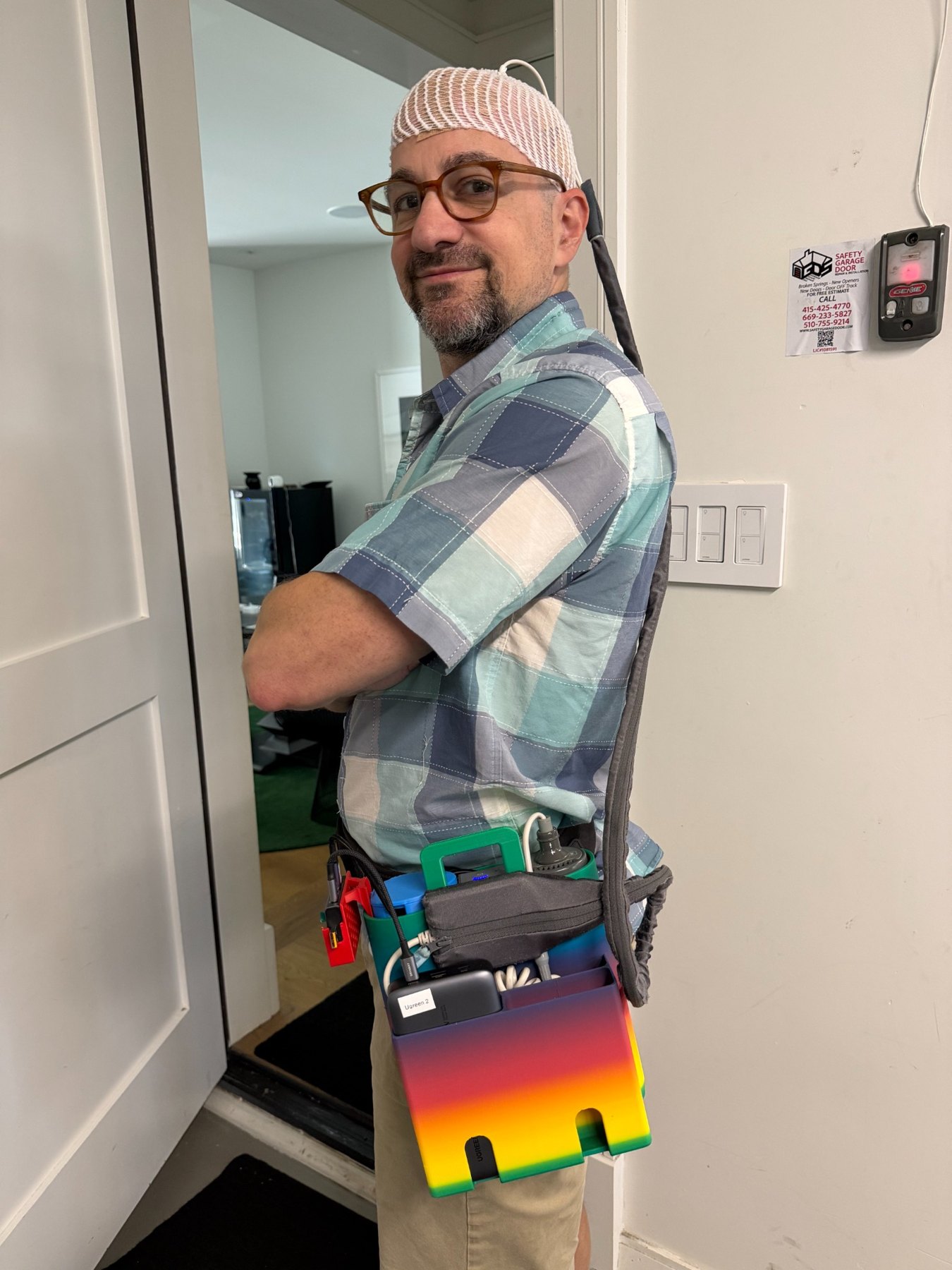 Dan wearing Optune, showing the head arrays and the device carried at his waist